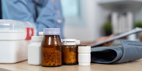 Medication Management. Various medicine bottles displayed during a healthcare consultation.