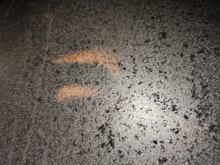 Close-up texture of a burnt and aged cooking pan.