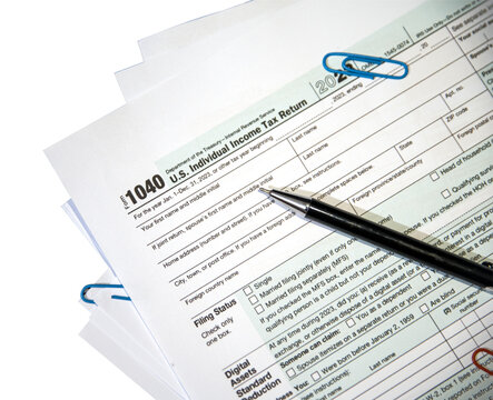 U.S. Tax form 1040 with pen on paper top view close up png, no backdrop. Isolated tax form, copy space, finance, income tax return