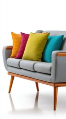 Modern grey sofa with colorful cushions in bright interior setting