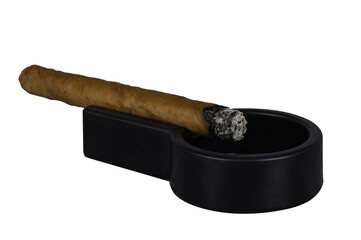 a lit cigar lies on an ashtray on a transparent background