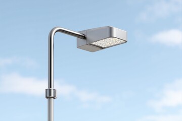 Modern street light with square headlamp on a sky background. Concept of city lighting and urban infrastructure.