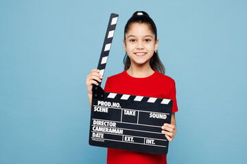 Little child kid girl 8-9 years old wear red t-shirt have fun hold in hand classic black film...