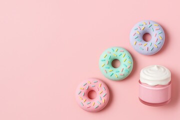Donut-shaped bath bombs and pink mask jar with “icing” in the bottom right. Rest is light pastel for large text.