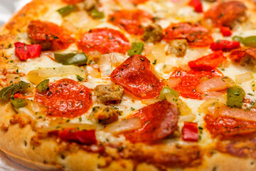 Pepperoni Pizza Closeup shot. A freshly made gourmet Italian cuisine is ready to eat. It's one of...