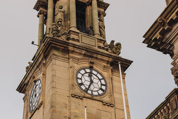 South Shields England: 21st Dec 2024: Clock Tower close-up of South Shields Town Hall on sunny winter day