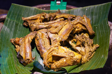 Assorted Side Dishes, Indonesia, captured on May 29, 2025. A variety of traditional Indonesian foods including tempeh, tofu, chicken, eggs, and vegetables served with sambal
