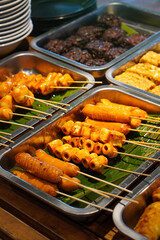 Assorted Satay, Indonesia, captured on May 29, 2025. A traditional Indonesian dish featuring skewered and grilled meat varieties served with spicy peanut sauce, soy glaze, and fresh side dishes