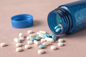 Prescription opioids, with bottle of many pills on the mirror light table. Concept of addiction, opioid crisis, overdose and medicine shopping. High quality image