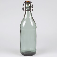 Vintage green glass bottle with wire closure on neutral background