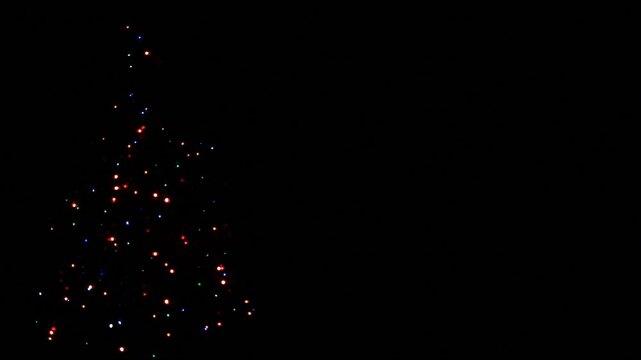 Footage of retro style Christmas tree garland on empty black background