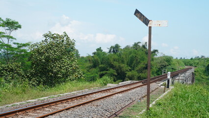 rural railroad tracks and signs