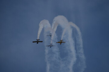 Aerobatic Vans RV 8 Planes Performing Collaboration in Precision Flying Under Clear Blue Skies at south african airshow