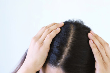 Fototapeta premium Damaged Hair symptom, women worry about balding, hand in break into front hair loss, thin problem. Health care treatment for beauty concept. hair transplant.