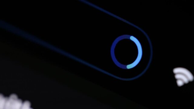 File loading animation on oled display, dark theme, smartphone display in macro