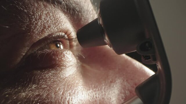 A device for measuring intraocular pressure. Close-up of the eye during diagnosis. The concept of ophthalmologic diagnosis and treatment.