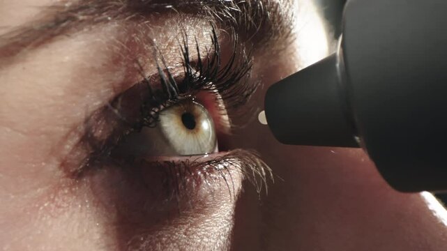 A device for measuring intraocular pressure. Close-up of the eye during diagnosis. The concept of ophthalmologic diagnosis and treatment.