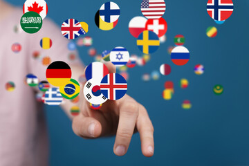 Diverse flags float around a hand, symbolizing international collaboration and global reach.