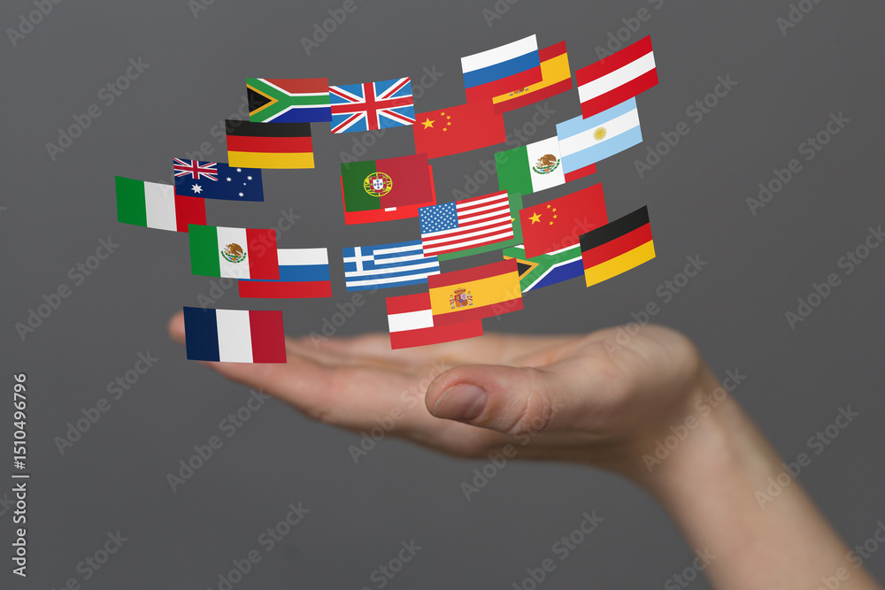 Leinwandbilder Image of many flags floating above a hand, representing global communication and international relations.