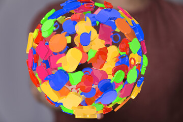 Abstract image of colorful speech bubbles arranged in a sphere, representing communication and...