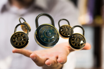 Image of combination locks floating above an outstretched hand, symbolizing data security and...