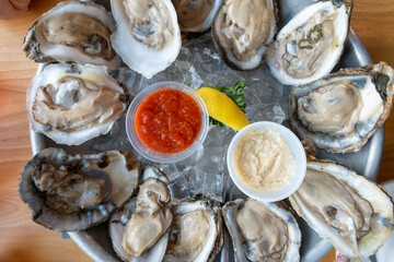 SOlomons, Maryland USA A dozen oysters on the half-shell on ice.