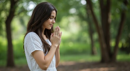 Fototapeta premium Woman Prayer Hands Gesture Outdoor Park Nature Spiritual Meditation Wellness. Female White SHIRT PEACEFUL EXPRESION GRATITUDE MINDFULNESS Relaxation Concept