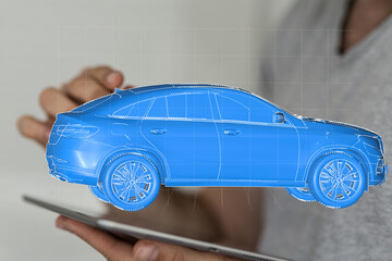 Innovative automotive design.  3D model of a sleek SUV displayed on a tablet.
