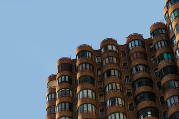 Modern residential building with curved balconies in Benidorm, Spain. Urban architecture image for...