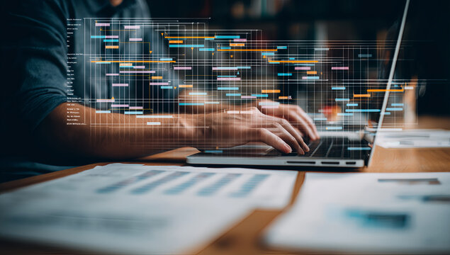 Business professional analyzing big data visualization on laptop computer screen - Powered by Adobe