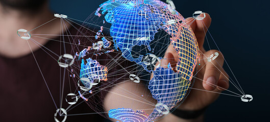 Person interacting with a digital globe, showcasing global network and connections.