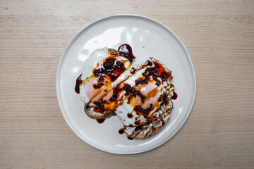 Fried egg with chilli on top.