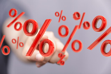 Abstract image of a hand interacting with floating percentage symbols. Ideal for finance, sales,...