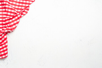 Fototapeta premium Kitchen table with wooden cutting board and red kitchen towel.