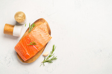 Salmon fish with herbs on white background.