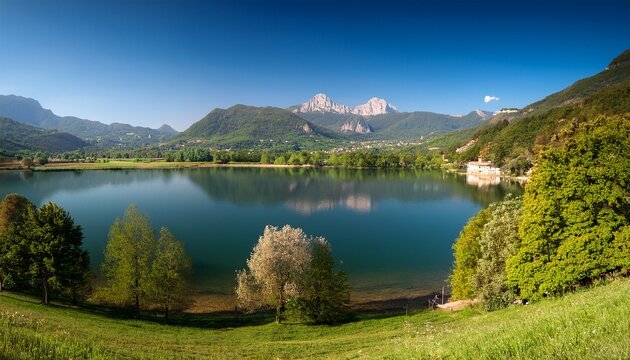 scenic view of lago di annone with monte resegone and civate in the background