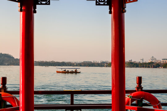 Sunset scenic view with the boat at Xihu(west lake),located at hangzhou city in Zhejiang province,China
