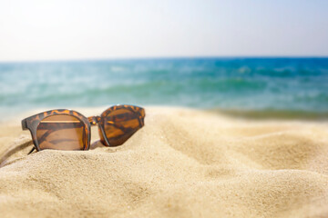 Soft golden sand under a clear blue sky on a hot summer day. Sunny beach sand with empty space for...