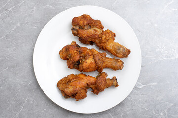 Traditional indonesian fried chicken with spices ayam rempah
