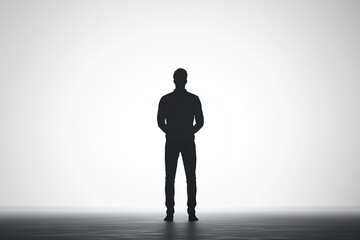 Obraz premium Lone man standing tall silhouette