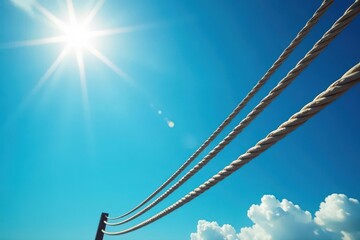 Thick ropes against a vibrant blue sky, sunlit , texture, adventure