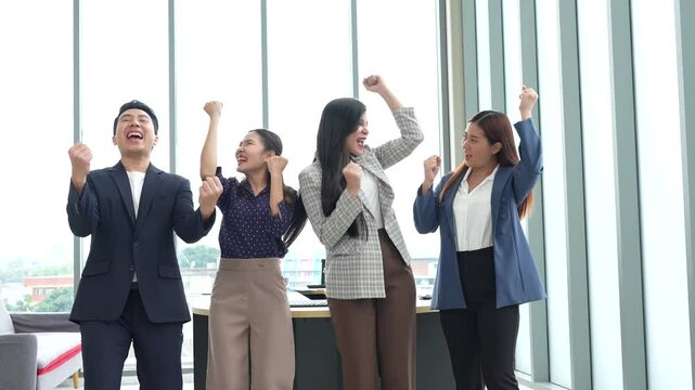 Asian entrepreneur group collaborates in office, fostering teamwork and cooperation to achieve their startup objectives. Their positive partnership drives success, creating a happy and successful job