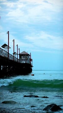 Wooden Pier Extending into the Pacific Ocean in Peru