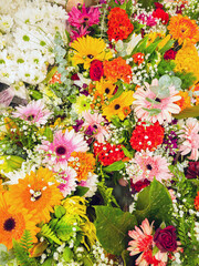 Colorful flower heads of roses, gerberas, chrysanthemums, gypsophila, dahlias close up.