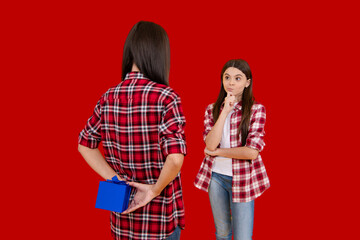 Mother and daughter. Gift for Mothers Day. Gift for mother. Birthday or Valentines Day for Mother. Womens Day. Surprise Mother with gift. Holiday with mom and child. Celebrate family event.