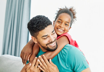 Obraz premium Portrait of father and daughter having fun at home