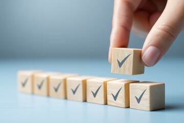 A hand placing a wooden block with a checkmark among other blocks, symbolizing task completion and organization.
