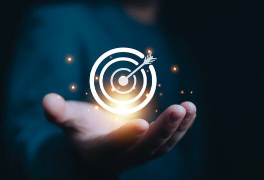 Businessman showing virtual target icon for business purpose, strategic planning for business growth and target customer group. Set business objectives goals, value, growth.	

