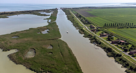 Porto Tolle is located between the Po di Maistra and Po di Gnocca rivers and is cut in half by the...