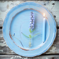 Aesthetic composition of lavender bloom and burning candle on blue plate